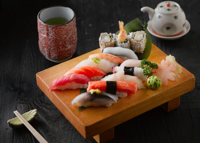 sushi on brown wooden board