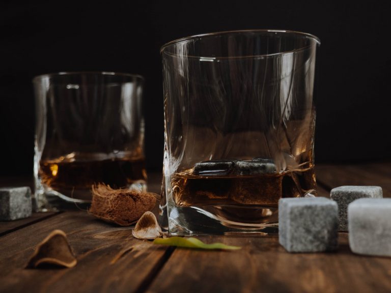 clear drinking glass with whiskey