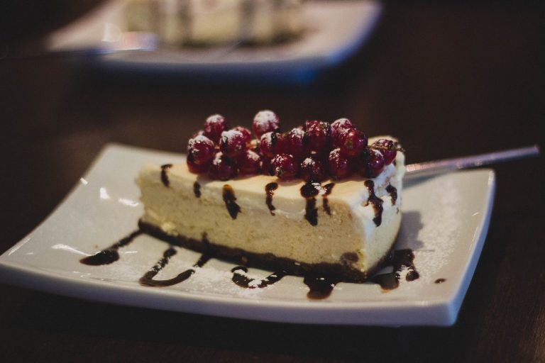 white chocolate cake on white ceramic plate