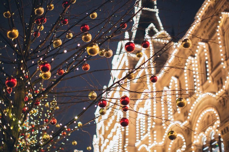 photo of christmas baubles on tree branches