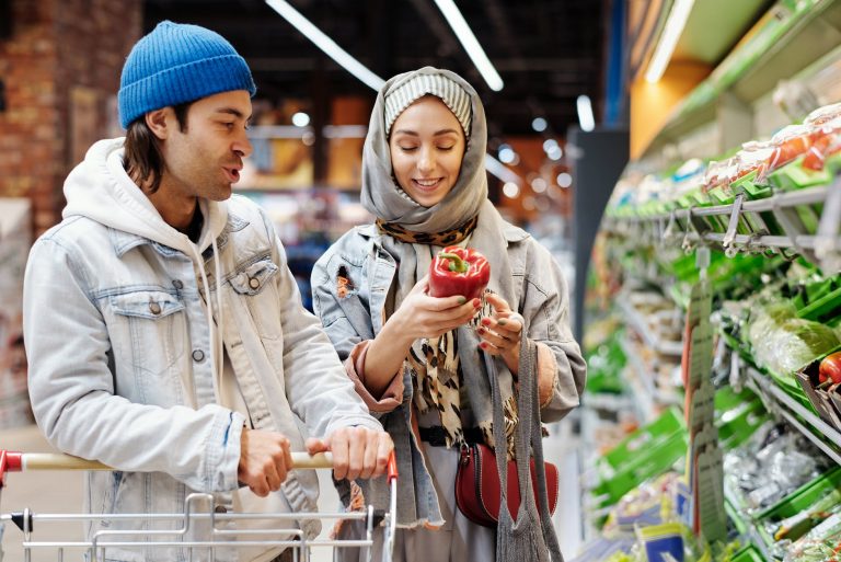 happy couple buying groceries