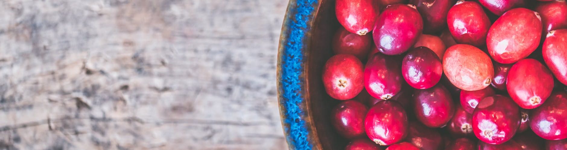 bowl of red round fruits