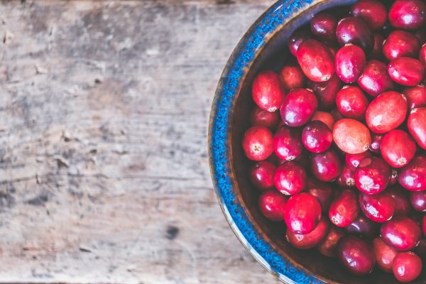 bowl of red round fruits