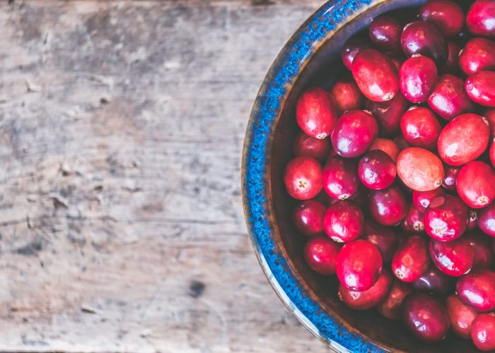 bowl of red round fruits