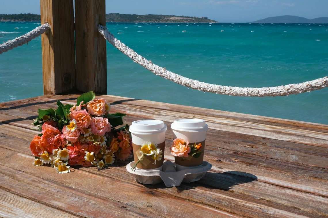 flowers and cups on pier