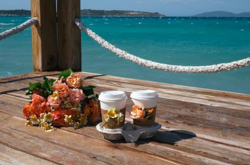 flowers and cups on pier