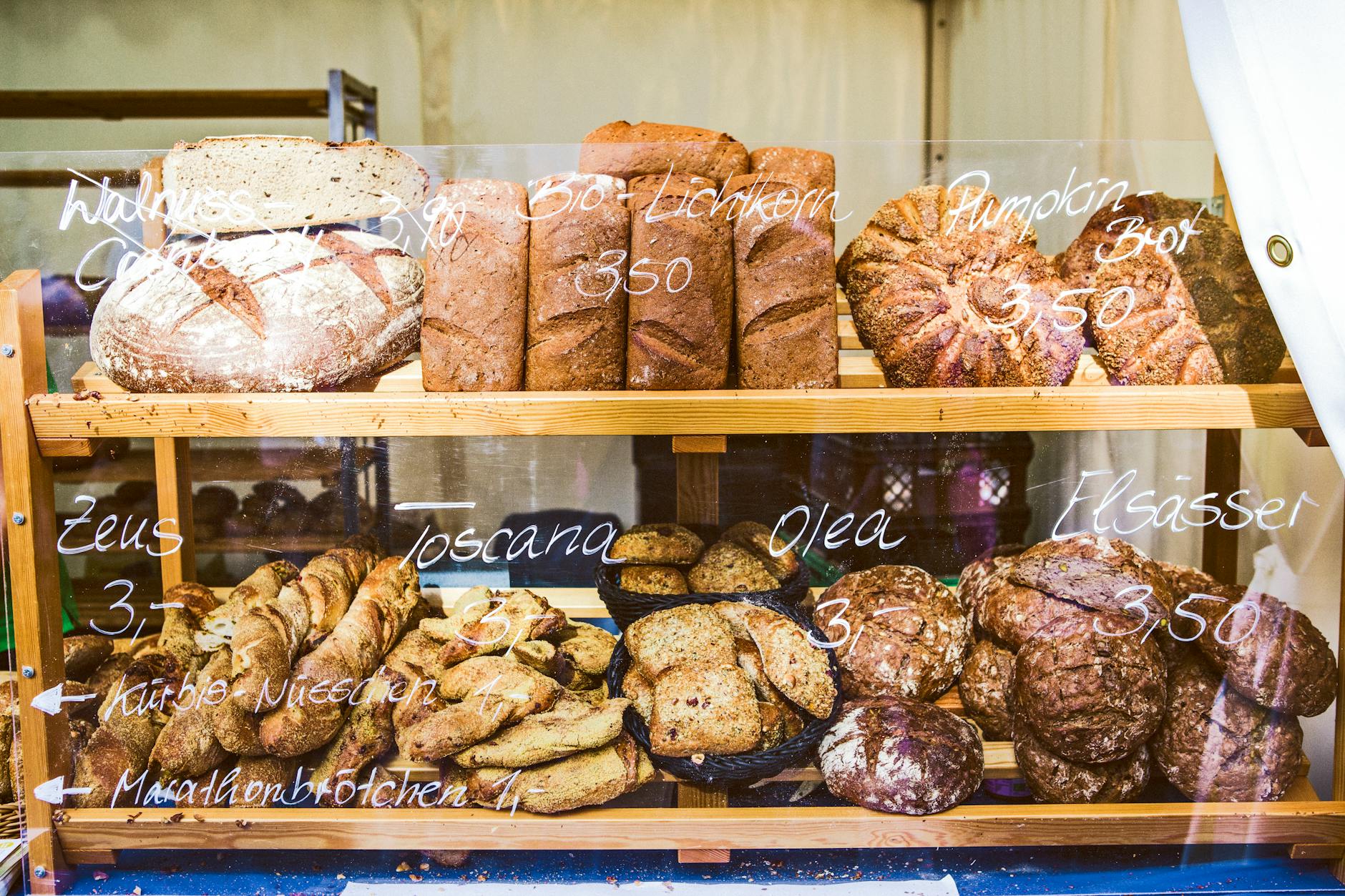 brown wooden rack with baked bread displayed