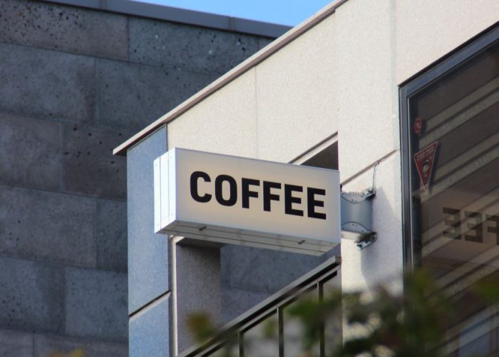 coffeeshop sign in modern seoul cityscape