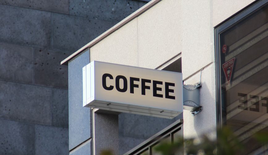 coffeeshop sign in modern seoul cityscape