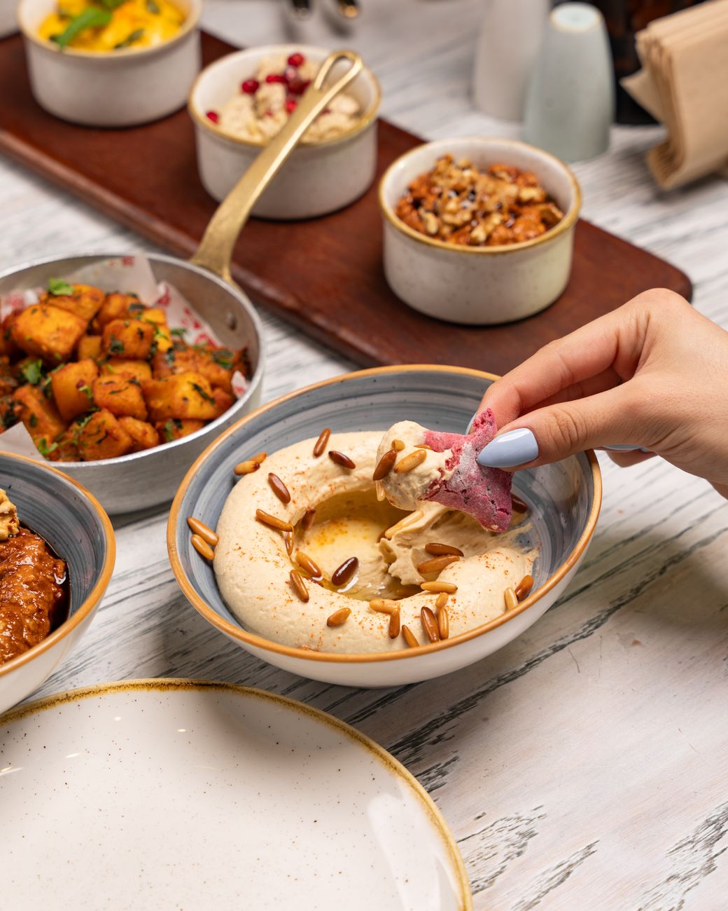 woman hand over bowl and tray with food